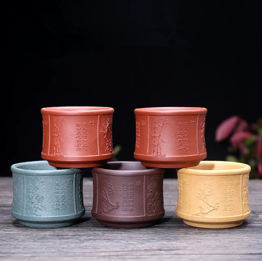 on big sales Chinese real yixing zisha tea cup floral character relief kungfu cup purple grit cup for Pu'er tea green tea marked