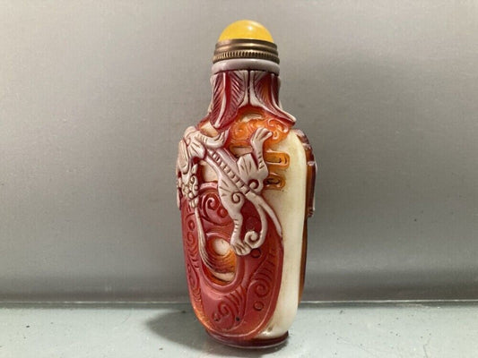 Fine red chinese snuff bottles peking glass overlay carved antique dragon statue