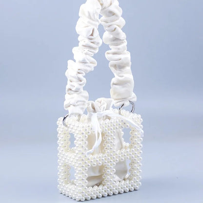 2023 New sweet one-shoulder hand-woven white beaded hollowed out square pearl handbag female woven mobile phone bag