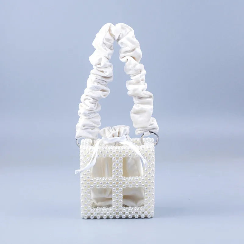 2023 New sweet one-shoulder hand-woven white beaded hollowed out square pearl handbag female woven mobile phone bag