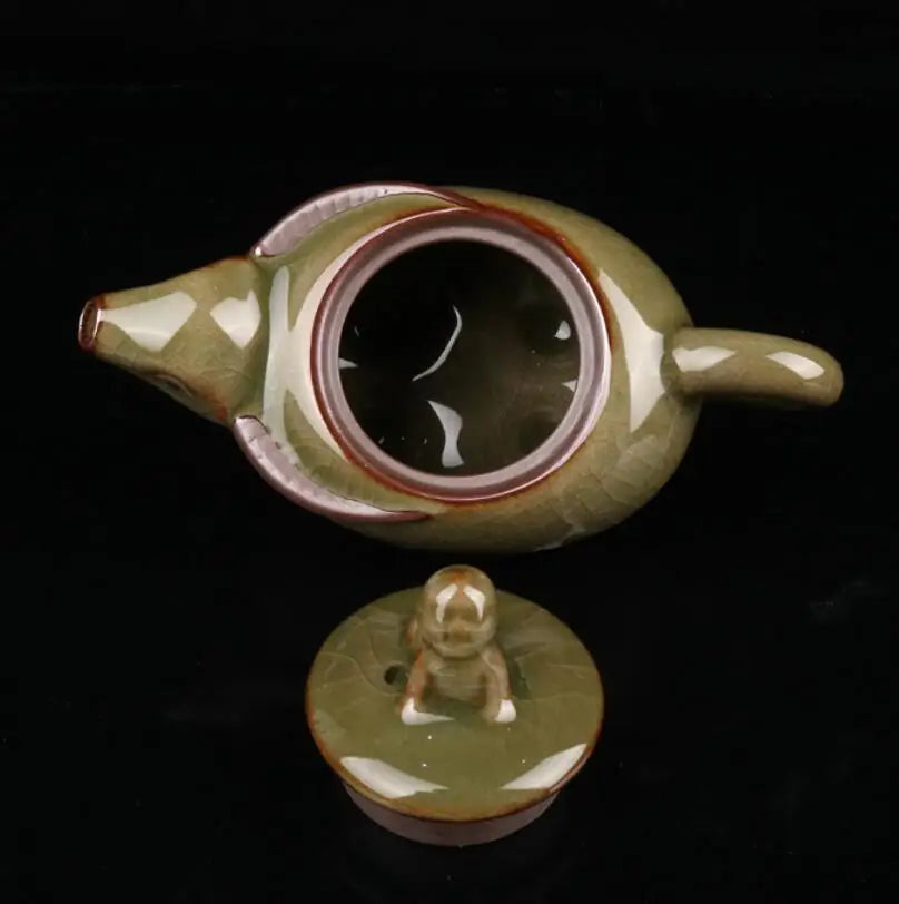 China Cyan glaze ceramic shepherd boy ride cow teapot crafts statue