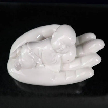 China seiko White glaze ceramic Buddha hand palm small monk crafts statue