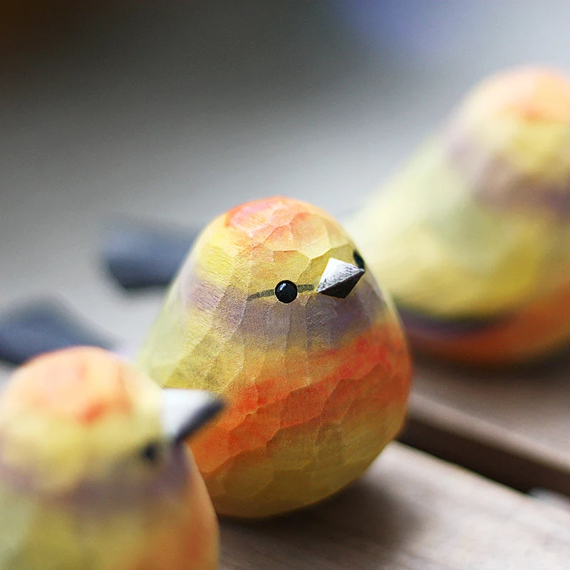 Colorful birds and warblers playing with wooden carved birds, small chubby birds, pure handmade solid wood tabletop ornaments