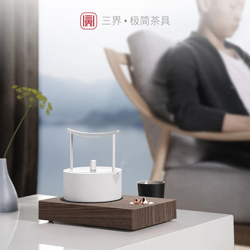 Concept of foam at the beginning of the three mountain electric TaoLu tea stove boiling tea stove tea mini tea tea set