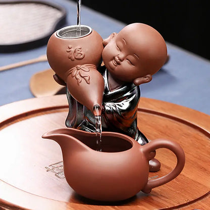 Creative little monk purple sand tea leak Kung Fu tea set accessories ceramic tea filter mesh lazy tea maker
