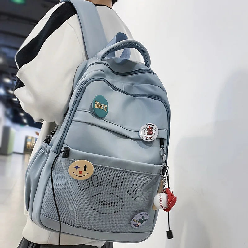 Fashion Men Women Mesh Travel Badge Waterproof Book Bag Cool Female Laptop Lady Net College Backpack Boy Girl Leisure School Bag