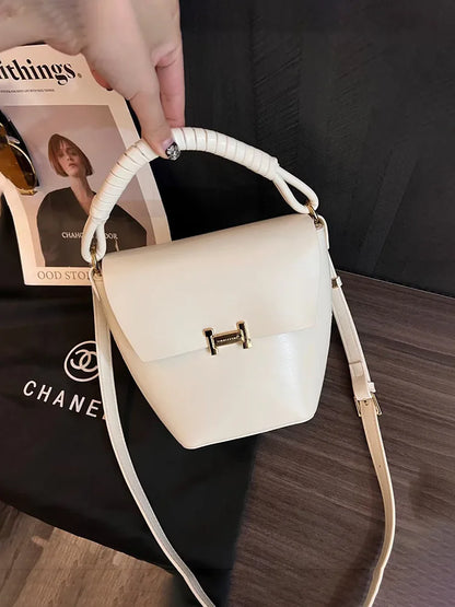 Fashionable genuine leather woven portable bucket bag for women 2024 new high-end sensory communication commuter bag