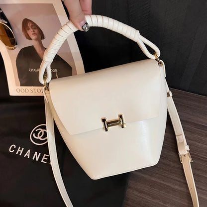 Fashionable genuine leather woven portable bucket bag for women 2024 new high-end sensory communication commuter bag