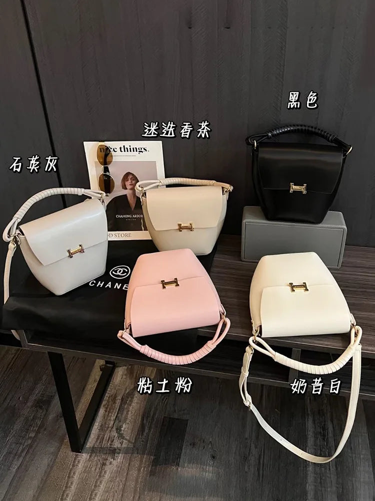 Fashionable genuine leather woven portable bucket bag for women 2024 new high-end sensory communication commuter bag