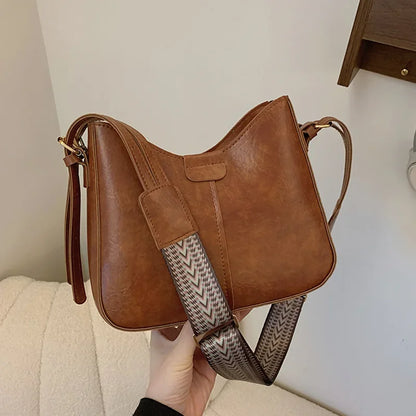 Retro Commuting Bags 2024 Women's Bag New Simple Bucket Bag Wide Shoulder Strap Crossbody Bag luxury bags designer