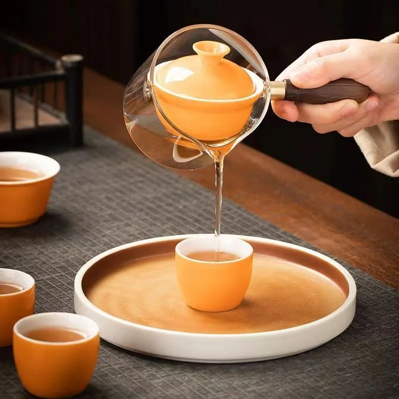 Side handle glass teapot, comfortable bubble rotating teapot, household portable travel tea set, internet red anti scald teapot