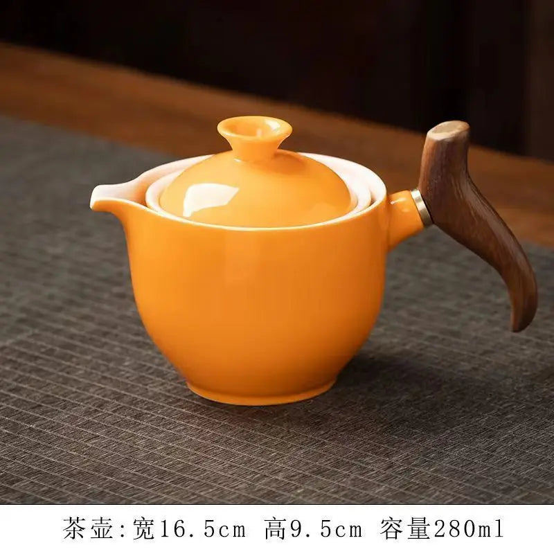 Side handle glass teapot, comfortable bubble rotating teapot, household portable travel tea set, internet red anti scald teapot