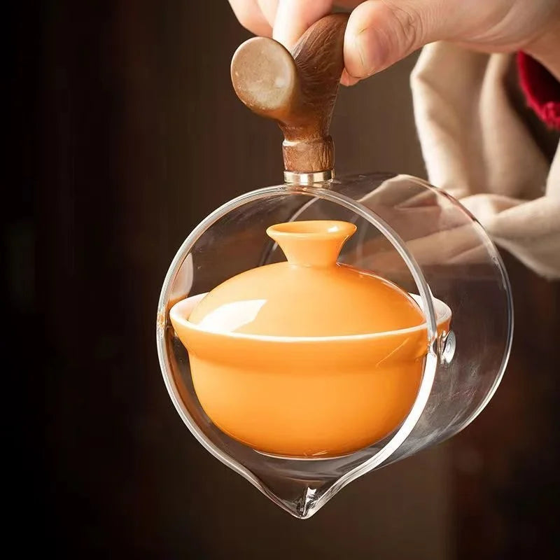 Side handle glass teapot, comfortable bubble rotating teapot, household portable travel tea set, internet red anti scald teapot