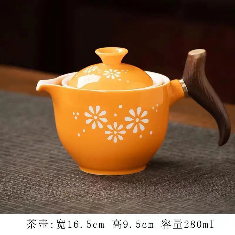 Side handle glass teapot, comfortable bubble rotating teapot, household portable travel tea set, internet red anti scald teapot