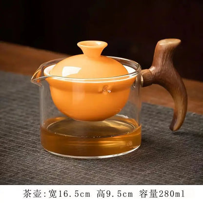 Side handle glass teapot, comfortable bubble rotating teapot, household portable travel tea set, internet red anti scald teapot