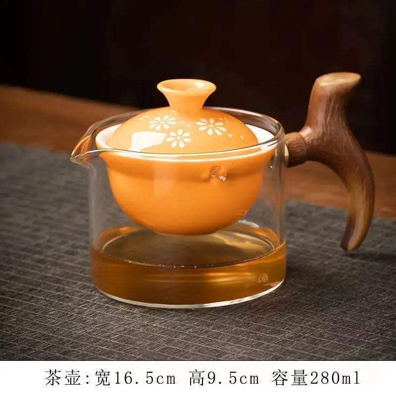 Side handle glass teapot, comfortable bubble rotating teapot, household portable travel tea set, internet red anti scald teapot