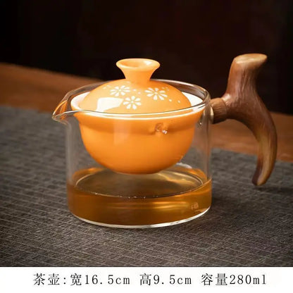 Side handle glass teapot, comfortable bubble rotating teapot, household portable travel tea set, internet red anti scald teapot
