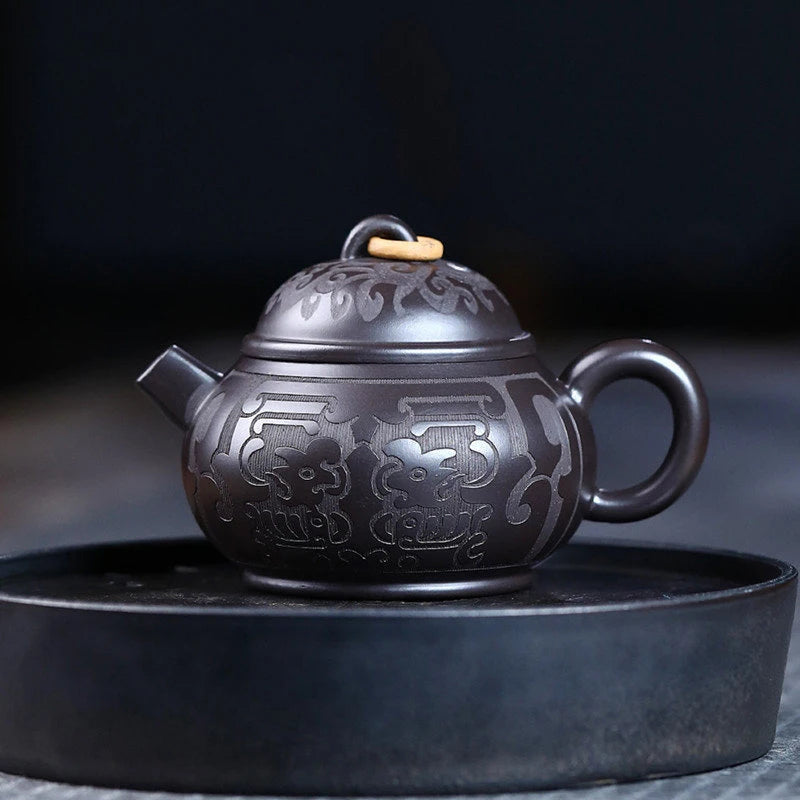 Tetera de barro negro tallada a mano, de arcilla Yixing auténtica, Teaware chino tradicional, juego de Zisha de belleza, 180ml