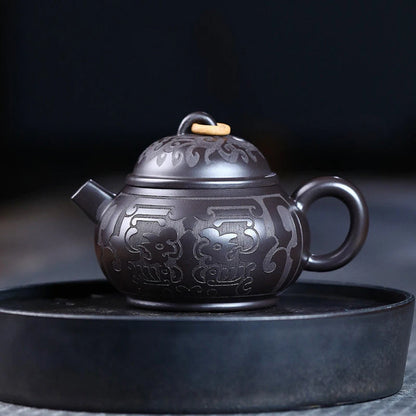 Tetera de barro negro tallada a mano, de arcilla Yixing auténtica, Teaware chino tradicional, juego de Zisha de belleza, 180ml