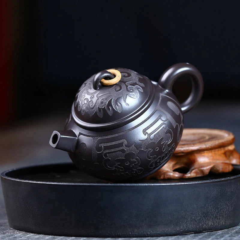 Tetera de barro negro tallada a mano, de arcilla Yixing auténtica, Teaware chino tradicional, juego de Zisha de belleza, 180ml