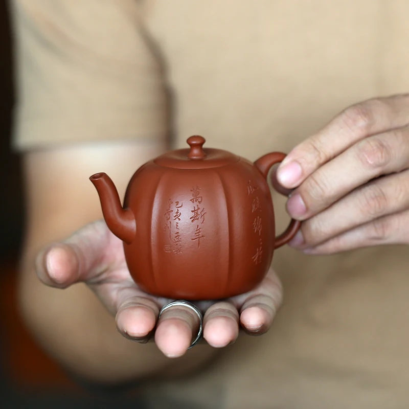 Yixing raw ore purple clay teapot pure handmade Huanglongshan vermilion clay melon ladder teapot 185ml rib bag modeling