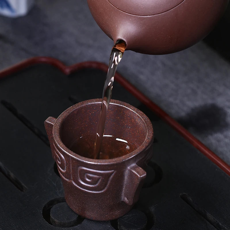 Zanghutianxia Purple Sand Tea Cup Sanxingdui Mask Creative Creative Master Cup Kung Fu Tea Cup Tea Cup Boccaro Cup Tea Cup