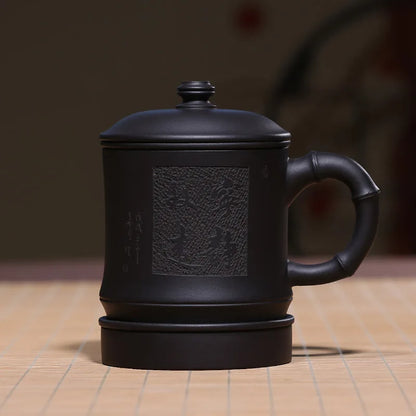 Zhenyi Yixing Zisha Cup is hand-made with inner liner, filter cover, tea cup and black mud engraving