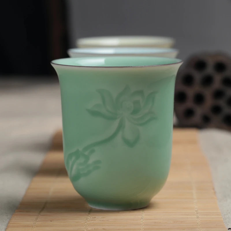 longquan celadon porcelain tea cup master carved lotus water lily engraved ceramic coffee cup one piece porcelain cups 130ml