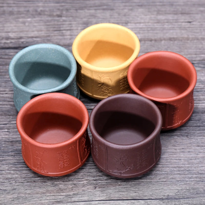 on big sales Chinese real yixing zisha tea cup floral character relief kungfu cup purple grit cup for Pu'er tea green tea marked