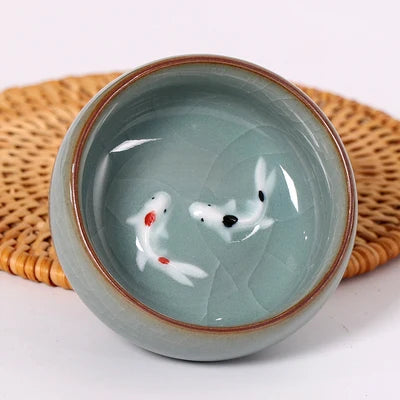 one tea cup longquan celadon porcelain fish relief carved kungfu cup of tea geyao crackle glaze master cup diyao craft in China
