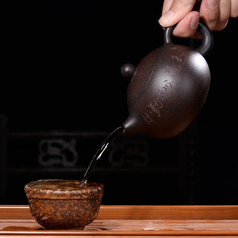 real yixing zisha tea pot + 2 tea cups marked xishi pot handmade carved Chinese characters ball-shaped infuser holes pot of tea