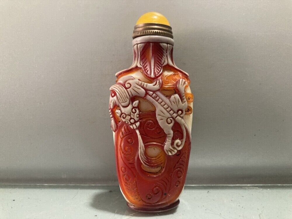 Fine red chinese snuff bottles peking glass overlay carved antique dragon statue