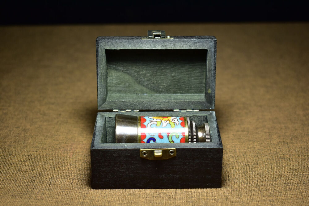 An ancient brass based cloisonne telescope