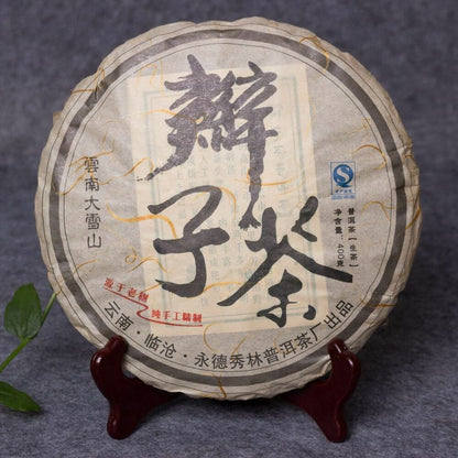 2014 Yong De Big Snow Mountain Bian Zi Pigtails Old Tree Pu'er Tea Cake Raw 400g