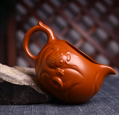 Yixing genuine handmade raw ore Dahongpao fish Hualong fair cup purple clay pot