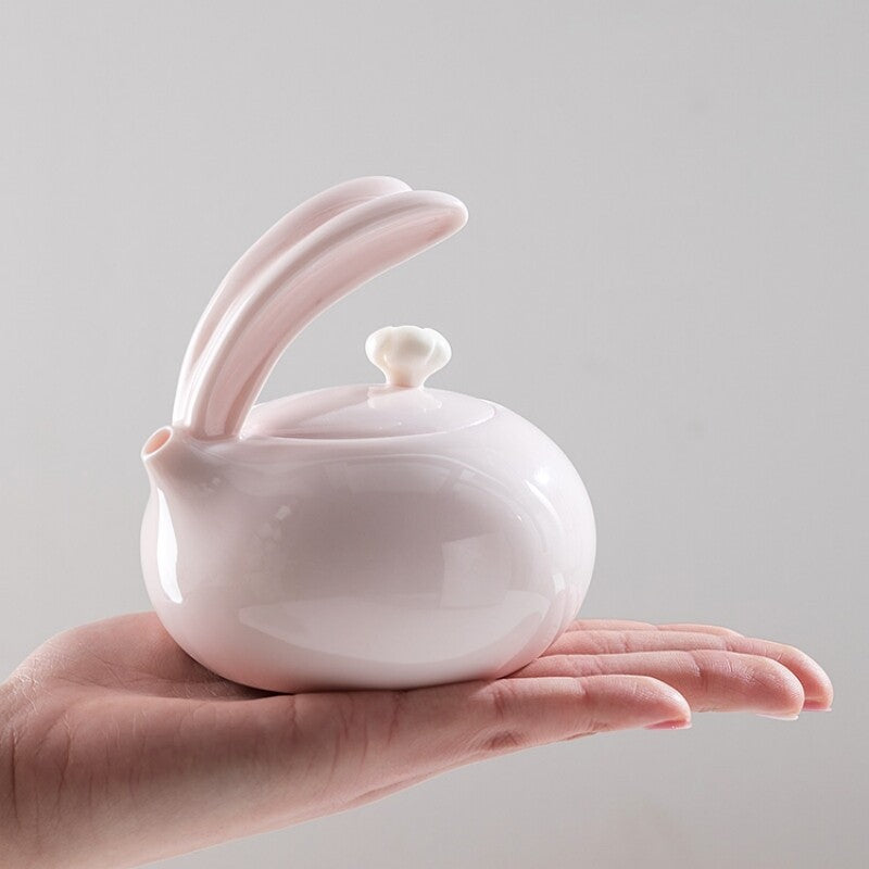 Porcelain Tea Set For Lady Pink Tea Pot Ball Shaped Infuser Hole Matching Teacup