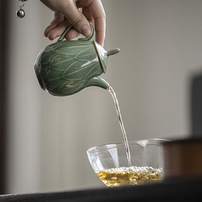 180ml Yue kiln porcelain tea pot with ball shaped infuser holes lotus relief pot