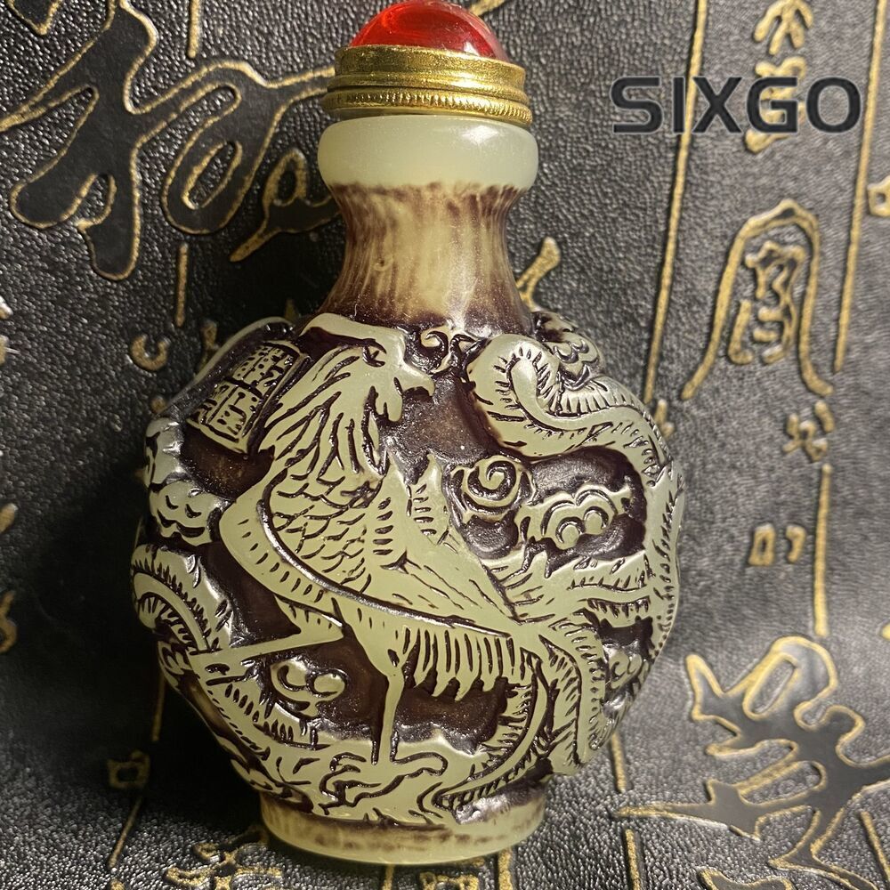 Ancient Chinese beautifully carved dragon and phoenix luminous snuff bottle