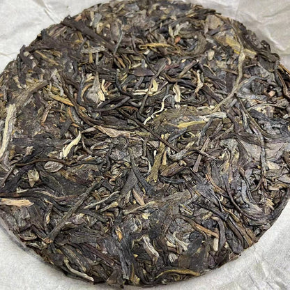 Rhinoceros Pond Head Spring Old Tree Puerh Raw Tea Tight Tea 100g Tea Cake