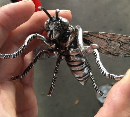 Hand sculpture of the Miao silver statue, realistic dragonfly