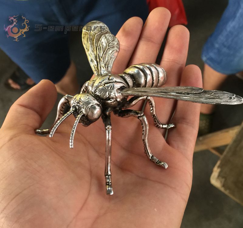 Hand sculpture of the Miao silver statue, realistic dragonfly