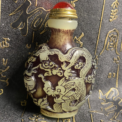 Ancient Chinese beautifully carved dragon and phoenix luminous snuff bottle