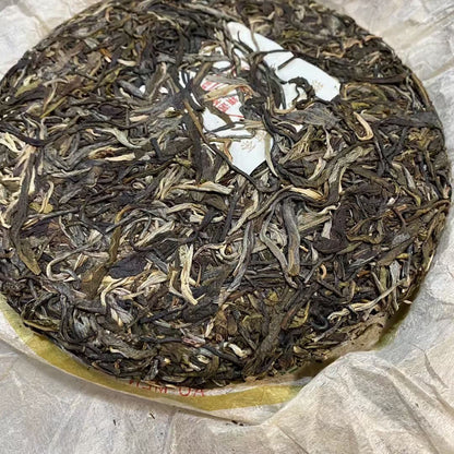 2005 HUA LIAN BAN ZHANG YEI SHENG GU SHU CHA 357g Yunnan Wild Pu'er Tea Cake