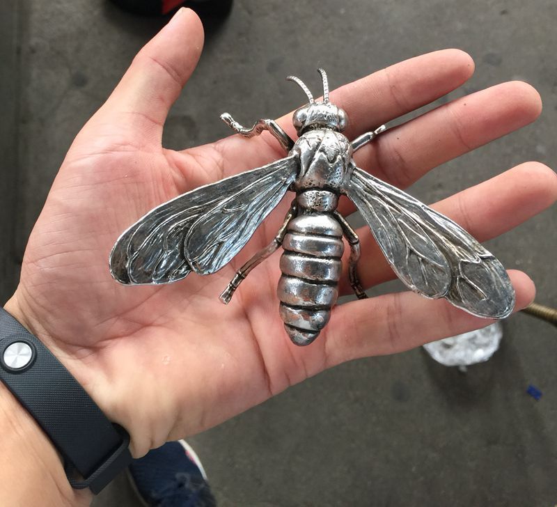 Hand sculpture of the Miao silver statue, realistic dragonfly