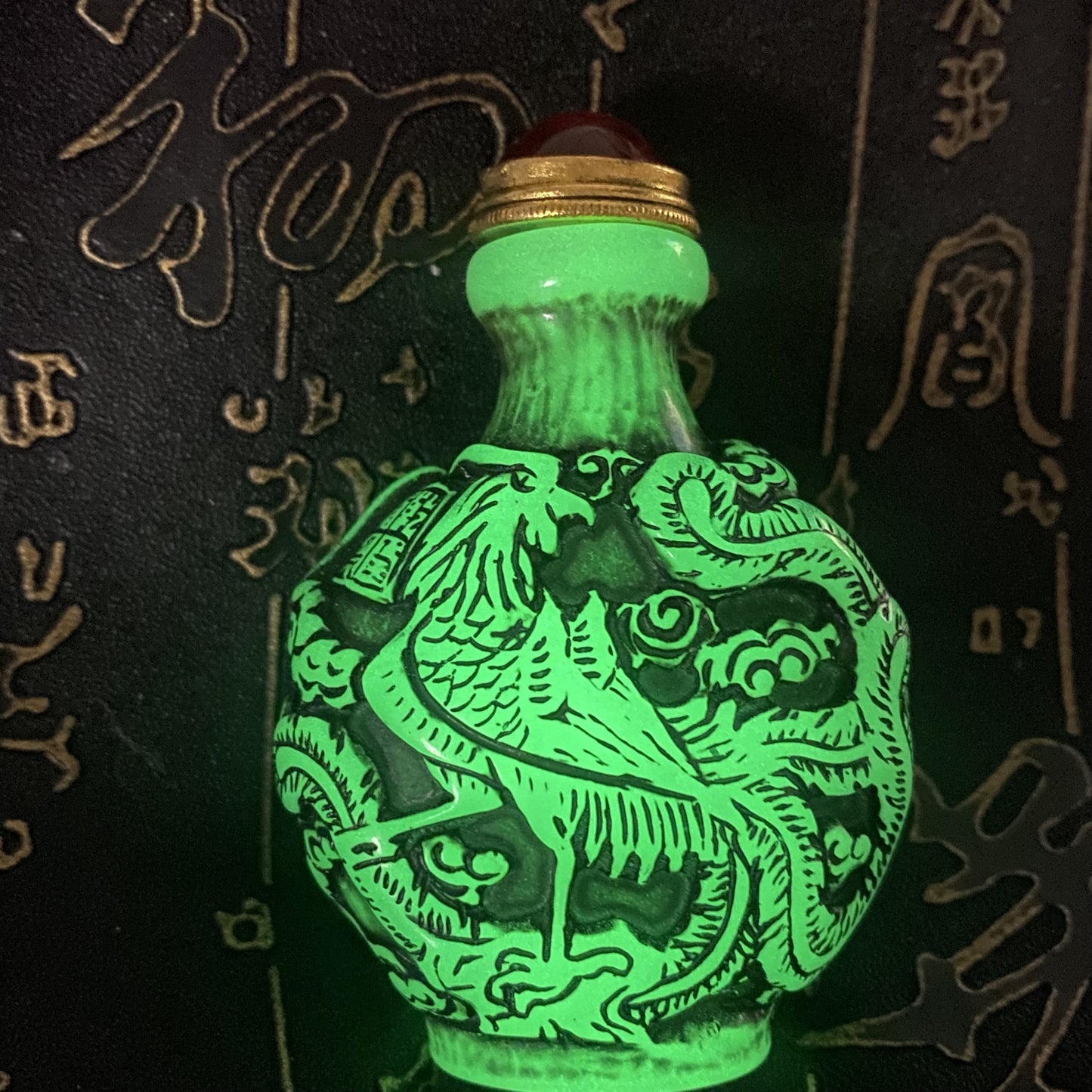 Ancient Chinese beautifully carved dragon and phoenix luminous snuff bottle