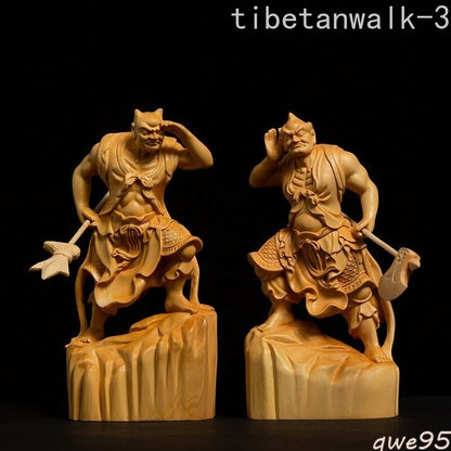 A Pair of Carved Guardian Statues Adorned with The Ears and Eyes of The Wind
