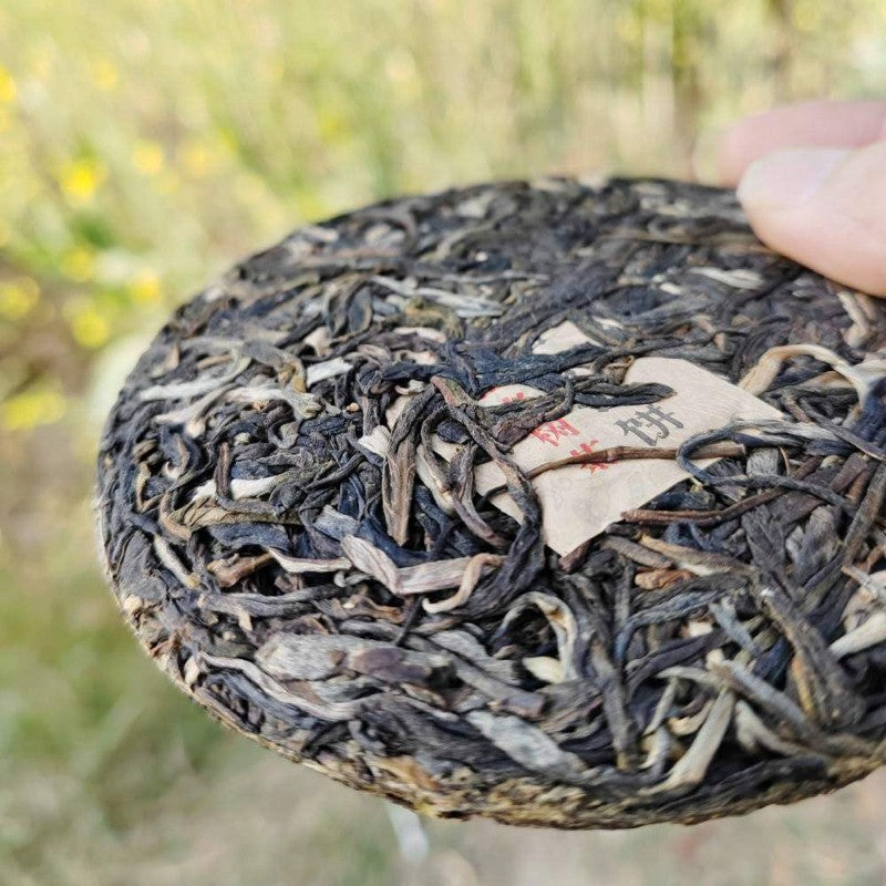 100G raw Pu'er tea Daxueshan ancient tree mini tea cake Yunnan Mengku -