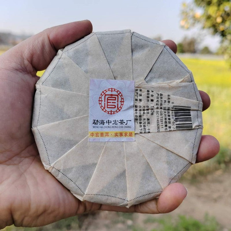 100G raw Pu'er tea Daxueshan ancient tree mini tea cake Yunnan Mengku -