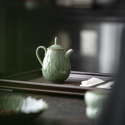 180ml Yue kiln porcelain tea pot with ball shaped infuser holes lotus relief pot