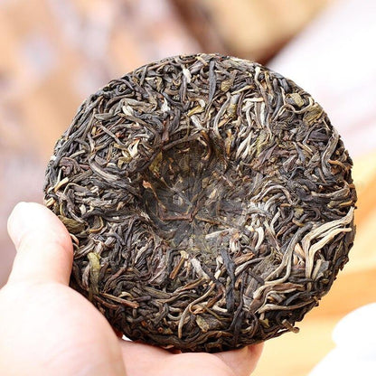 100gYunnan Tea Sheng Puer Lincang Tea Area Xigui Ancient Tree Raw Pu Er Tea Cake
